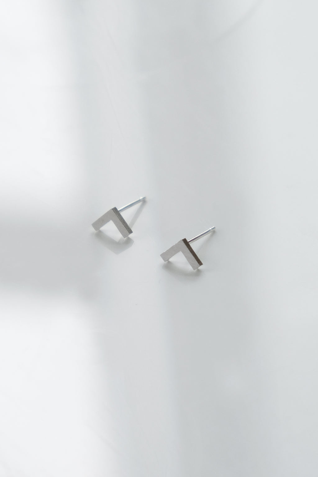 Small silver V earrings